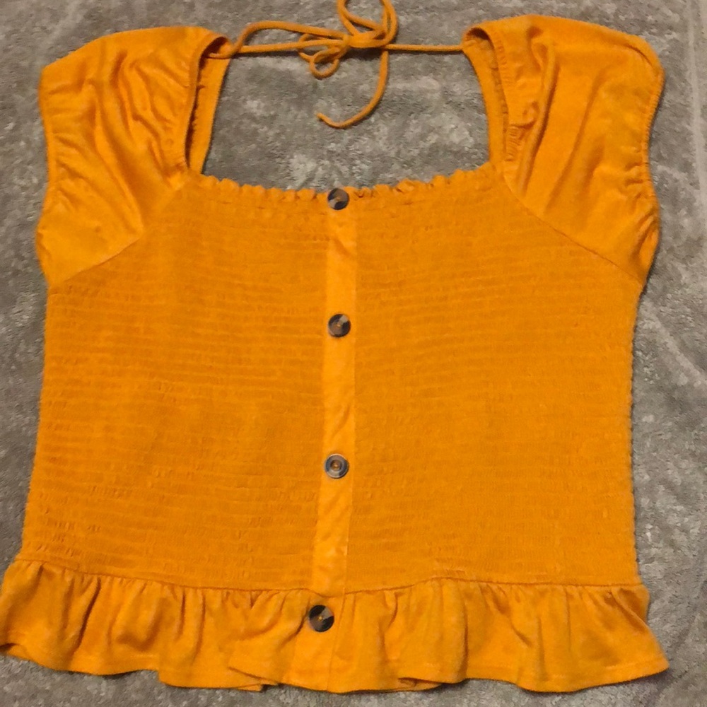 Yellow-orange, cropped off the shoulder blouse.